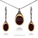 A set of silver jewelry with cherry amber