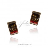 Gold-plated silver earrings with cherry-colored amber with scales