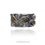 Silver ring FOGLIA, oxidized and gold-plated with cubic zirconia