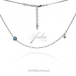 Silver necklace with a blue zircon - a combination of a fashionable rolo fleat chain with an anker