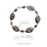 Silver, oxidized and gold-plated bracelet with FOGLIA cubic zirconia