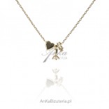 A subtle gold-plated necklace for a loved one - pendants: heart, wedding ring and engagement ring