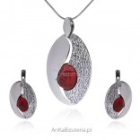 A set of silver jewelry with red coral