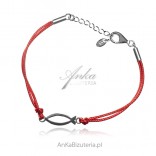 Silver bracelet on a red string with the sign FISH