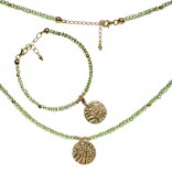 A gold-plated silver set with olivine with a minted coin