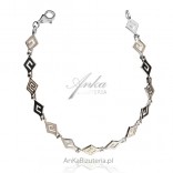 Silver bracelet with white opal with a Greek pattern