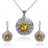 A set of silver oxidized jewelry with amber