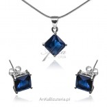 A set of silver jewelry with a sapphire zircon