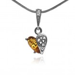 A small silver pendant with amber HEART