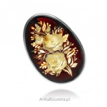 Silver brooch with cherry amber, hand carved