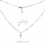 Silver necklace with a cross and black beads