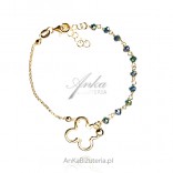 Gold-plated silver bracelet with green cubic zirconia and an artistic flower