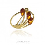 Gold-plated silver brooch with amber