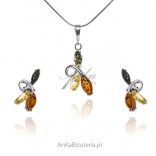 A set of silver jewelry with colored amber