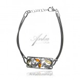 Women's silver bracelet with amber on a rubber chain