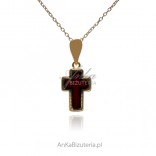 A small gilded cross with cherry amber