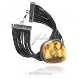 A beautiful silver bracelet with amber on black straps
