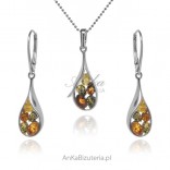 A set of silver jewelry with colored amber