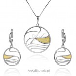 A set of silver jewelry with yellow amber