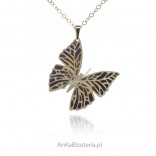 A large silver gold-plated butterfly pendant with titanium