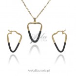 A set of gold-plated silver jewelry with black enamel