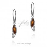 Subtle openwork silver earrings with cognac amber