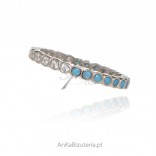 Silver ring with blue turquoise and zircons