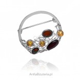 Elegant silver brooch with amber