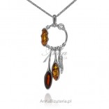 Silver pendant with amber in the color of cherry and cognac rhodium plated with white zircon