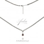 Exclusive jewelry - a silver necklace with white zircons and a red PARIS awning