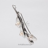 Silver brooch with pearls.