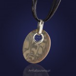 The original hand-made silver pendant with striped flint on a thong.