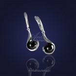 "The quintessence of femininity" - silver earrings rhodium-plated with onyx.