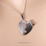 Silver rhodium-colored heart. Broken in two - "LOVES IT ONCE"