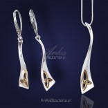 Extremely beautiful silver set with subtle gold inserts.