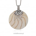 Pendant made of natural shell bound in silver.